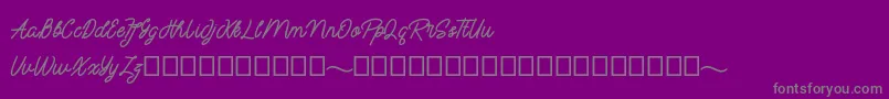 mayasarilah-fontti – harmaat kirjasimet violetilla taustalla