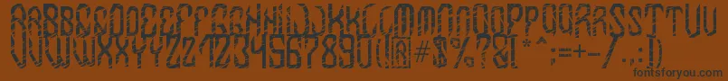 MB InDigit Font Font – Black Fonts on Brown Background