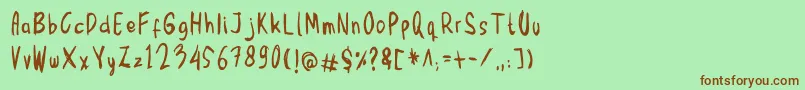 Шрифт Mbak Mbik1 Hitam – коричневые шрифты на зелёном фоне