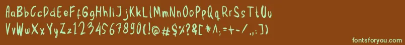 フォントMbak Mbik1 – 緑色の文字が茶色の背景にあります。