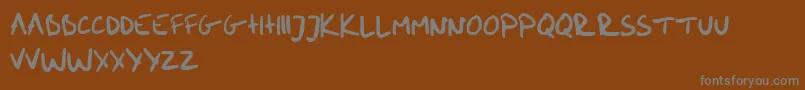 me handwritin Bold-Schriftart – Graue Schriften auf braunem Hintergrund