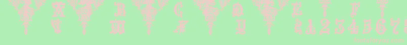 フォントMedieval Sorcerer Ornamental – 緑の背景にピンクのフォント