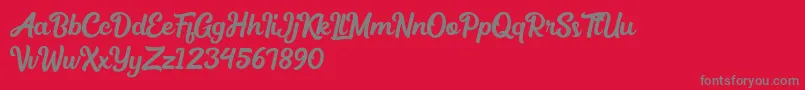 fuente Medinah – Fuentes Grises Sobre Fondo Rojo