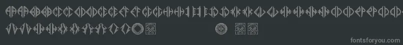 Mediogramo-fontti – harmaat kirjasimet mustalla taustalla