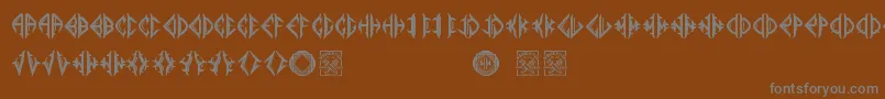 フォントMediogramo – 茶色の背景に灰色の文字