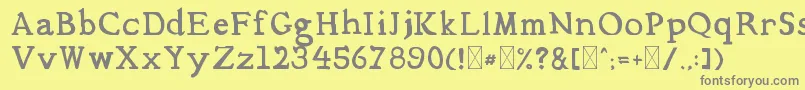 フォントMediqua – 黄色の背景に灰色の文字