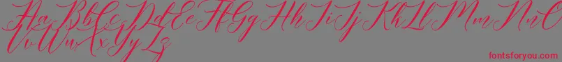 Meetha Script Demo Font – Red Fonts on Gray Background