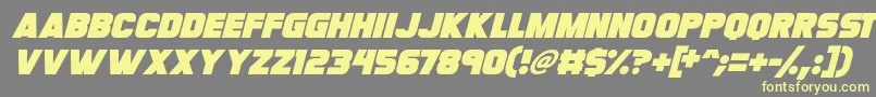 Czcionka Megabomb Italic – żółte czcionki na szarym tle