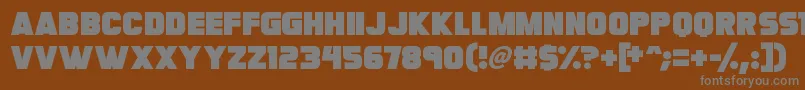 Megabomb-fontti – harmaat kirjasimet ruskealla taustalla