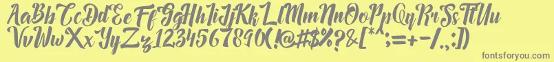 Megalia-Schriftart – Graue Schriften auf gelbem Hintergrund