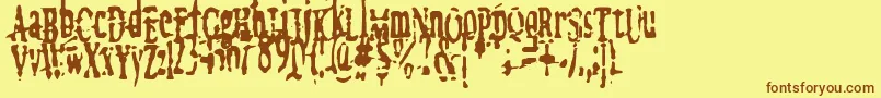 フォントmegalomania   x – 茶色の文字が黄色の背景にあります。