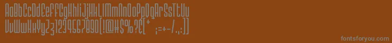 Шрифт Megalomaniac Headliners – серые шрифты на коричневом фоне