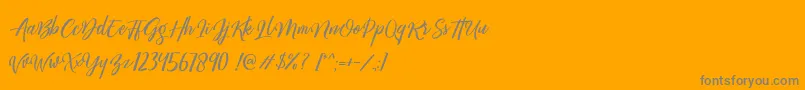 Megattor DEMO-Schriftart – Graue Schriften auf orangefarbenem Hintergrund