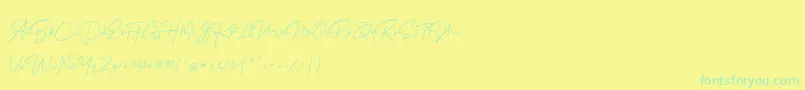 フォントMelanicBlackScript Regular – 黄色い背景に緑の文字