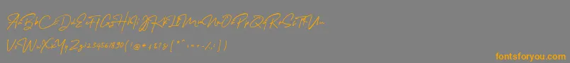 MelanicBlackScript Regular-Schriftart – Orangefarbene Schriften auf grauem Hintergrund