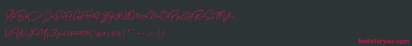 MelanicBlackScript Regular Font – Red Fonts on Black Background
