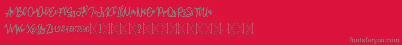 フォントmelankolis – 赤い背景に灰色の文字