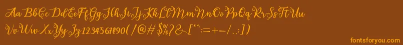 melda-Schriftart – Orangefarbene Schriften auf braunem Hintergrund