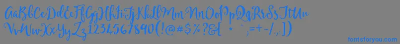Mellanie Free Sample Font – Blue Fonts on Gray Background