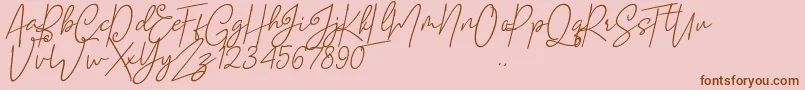 Mellati-Schriftart – Braune Schriften auf rosa Hintergrund