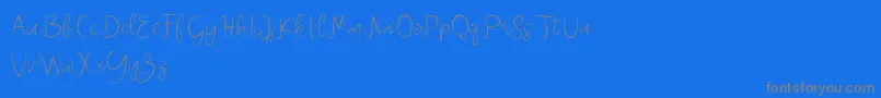 Melliana Demo-fontti – harmaat kirjasimet sinisellä taustalla