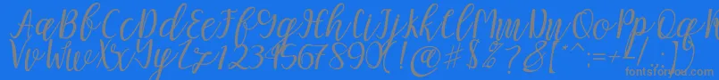 Mellitta script-Schriftart – Graue Schriften auf blauem Hintergrund