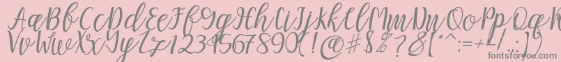 Mellitta script-Schriftart – Graue Schriften auf rosa Hintergrund