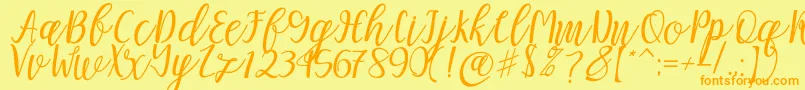 Mellitta script-fontti – oranssit fontit keltaisella taustalla