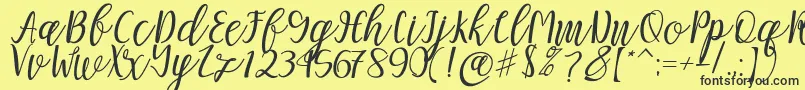 フォントMellitta script – 黒い文字の黄色い背景