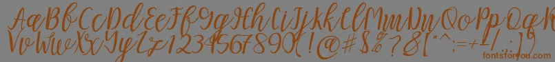 Подробнее о шрифте Mellitta script Шрифт Mellitta script – коричневые шрифты на сером фоне