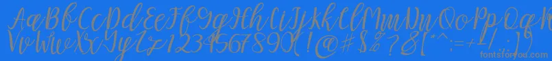 Mellitta script-Schriftart – Graue Schriften auf blauem Hintergrund