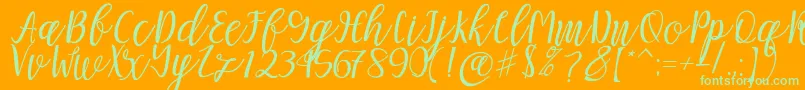 Mellitta script Font – Green Fonts on Orange Background