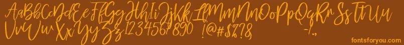 mellony dry brush-Schriftart – Orangefarbene Schriften auf braunem Hintergrund