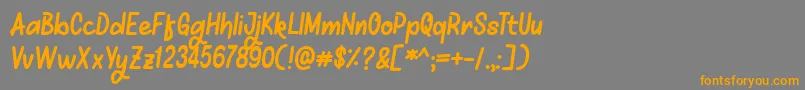 フォントMellows – オレンジの文字は灰色の背景にあります。