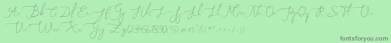 フォントMelly Eret – 緑の背景に灰色の文字