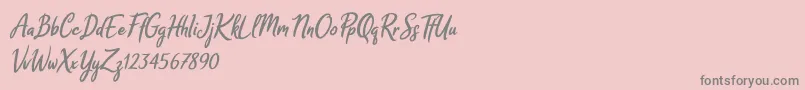 Czcionka Melodya Chatrina Italic – szare czcionki na różowym tle