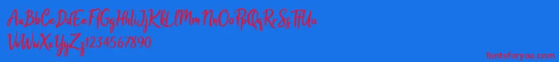 Melodya Chatrina-Schriftart – Rote Schriften auf blauem Hintergrund