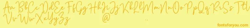 Fonte Mention Signature – fontes laranjas em um fundo amarelo