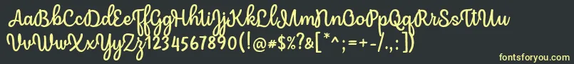 Mergic Regular Font by Situjuh 7NTypes Font – Yellow Fonts on Black Background