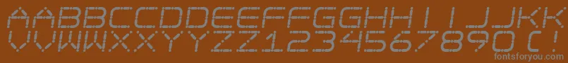 EgotripS-fontti – harmaat kirjasimet ruskealla taustalla