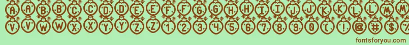 フォントMerry Xmas St – 緑の背景に茶色のフォント