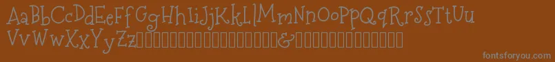 MerryNBright DEMO-fontti – harmaat kirjasimet ruskealla taustalla