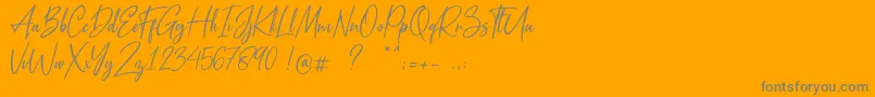 Metal Pen-Schriftart – Graue Schriften auf orangefarbenem Hintergrund