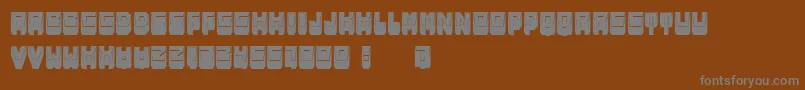 MetallicShadowFilled-fontti – harmaat kirjasimet ruskealla taustalla