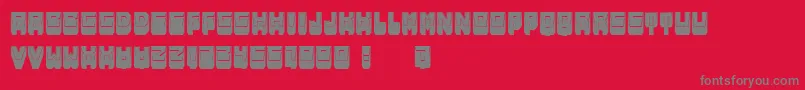 MetallicShadowFilled-fontti – harmaat kirjasimet punaisella taustalla