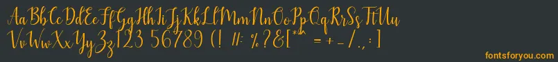 フォントMezabetto – 黒い背景にオレンジの文字