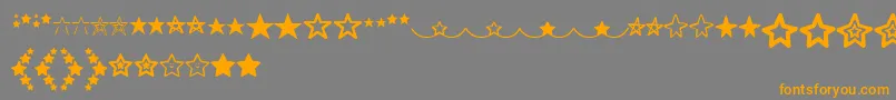 MF Star Dings  -Schriftart – Orangefarbene Schriften auf grauem Hintergrund