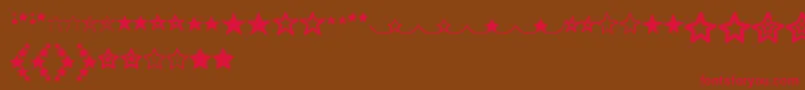 MF Star Dings  -Schriftart – Rote Schriften auf braunem Hintergrund
