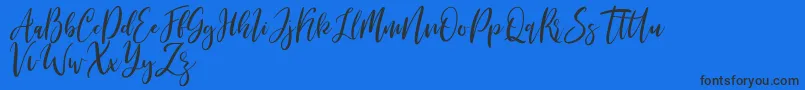 Шрифт Michelles free – чёрные шрифты на синем фоне