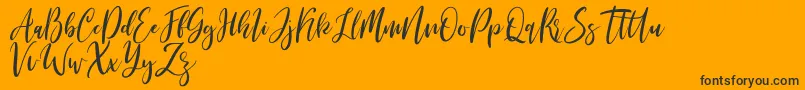 Michelles free Font – Black Fonts on Orange Background